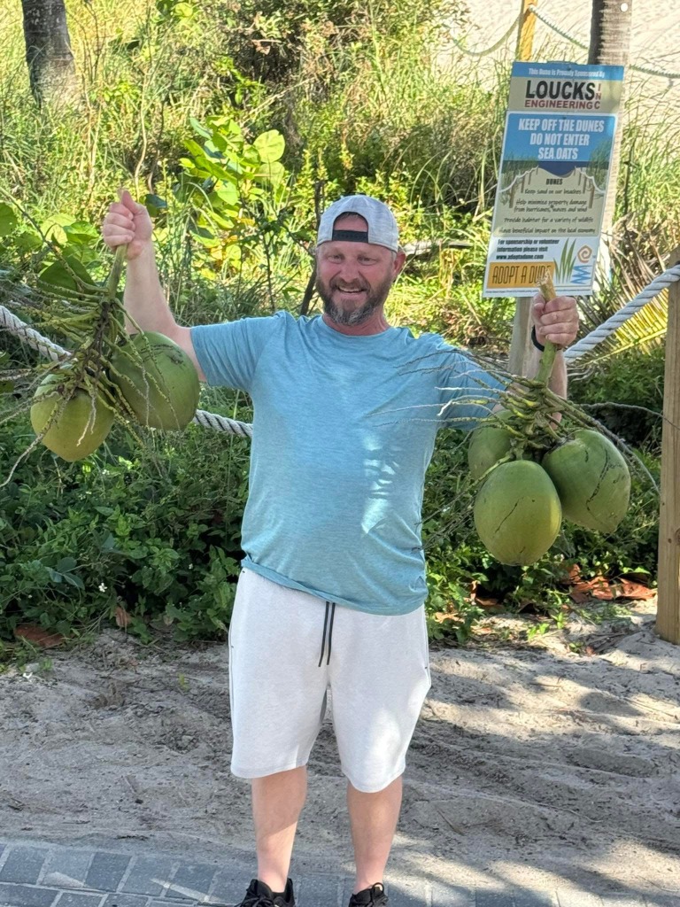 TooShort holding coconuts